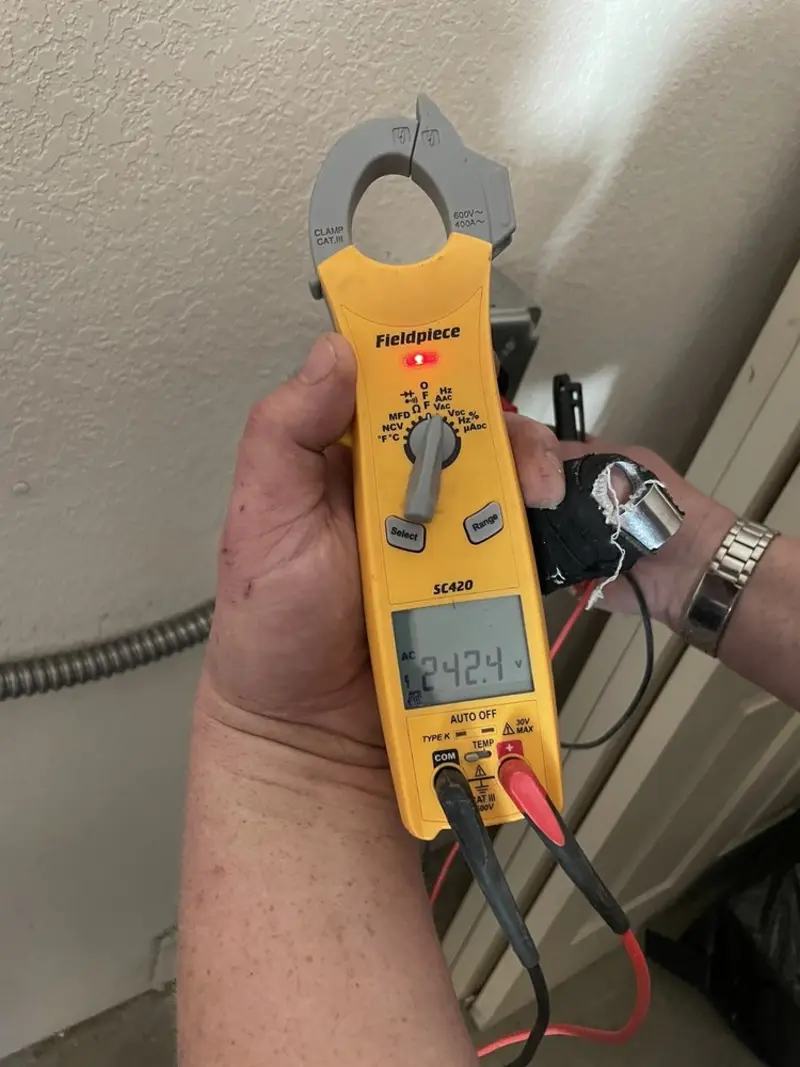 Voltage testing with clamp meter during Ceiling Fan Installation in Wantage